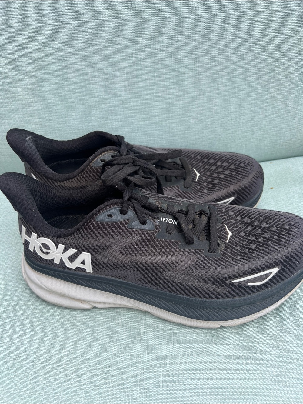 Hoka Black and White Clifton 9 Cushioned Running Shoes